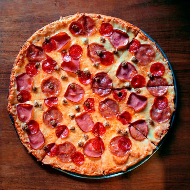 Pepperoni pizza photographed from above — illustrative stock photograph