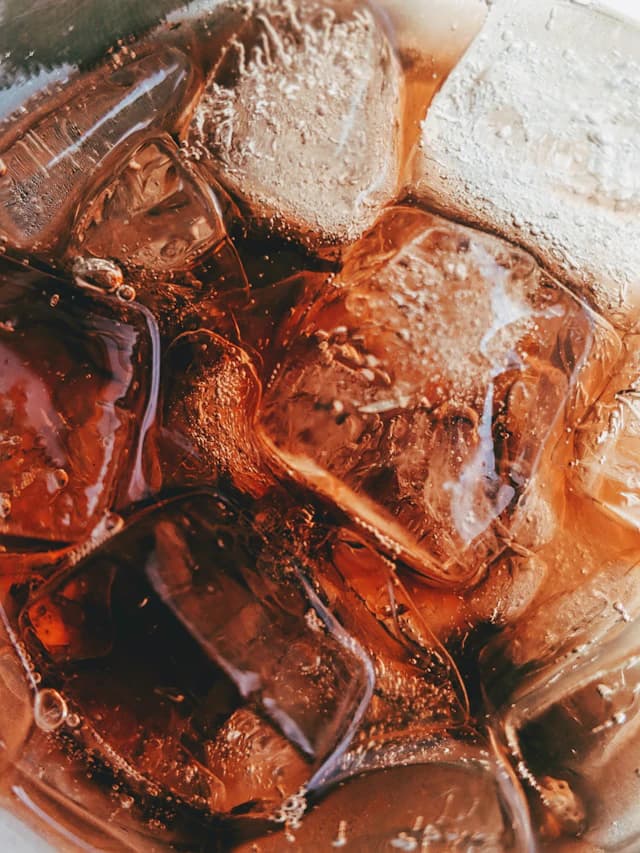 Chilled amber iced tea with ice cubes — illustrative stock photograph