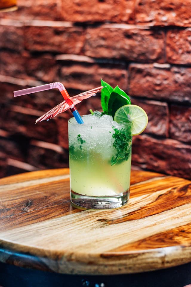 Green lime and mint cooler served over ice — illustrative stock photograph